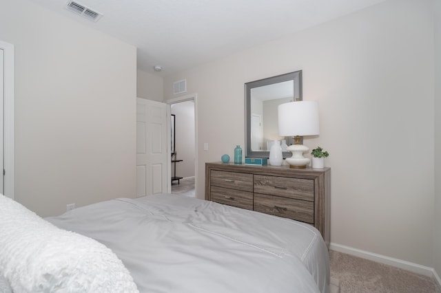 bedroom with light colored carpet