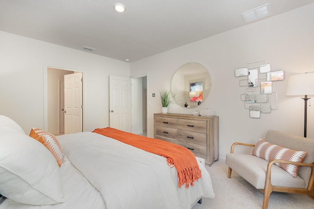 bedroom featuring light colored carpet