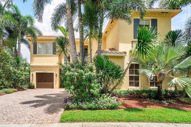 mediterranean / spanish-style home featuring a garage