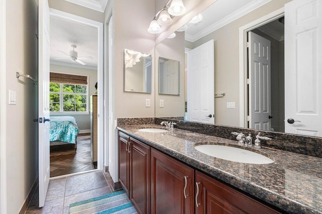 bathroom with ornamental molding, parquet floors, vanity, and ceiling fan