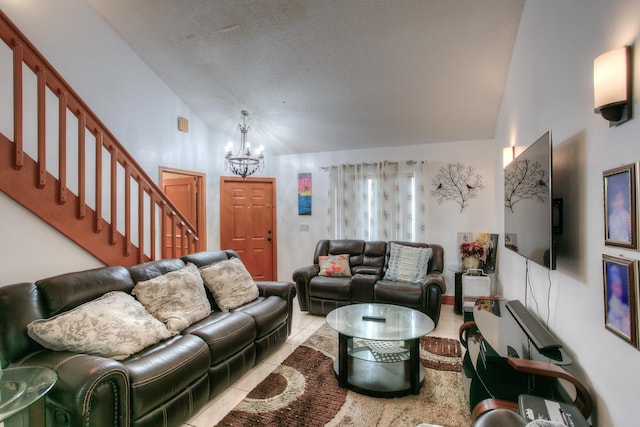 living room featuring a notable chandelier, light tile patterned flooring, high vaulted ceiling, and a textured ceiling