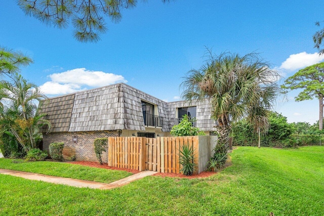 view of home's exterior featuring a lawn