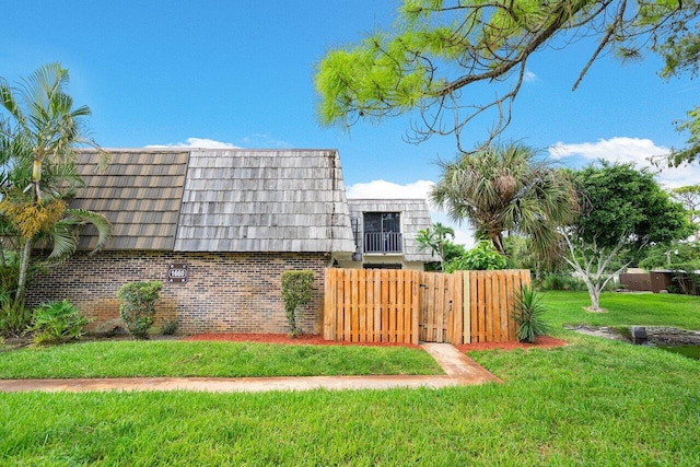 view of yard with fence and a gate