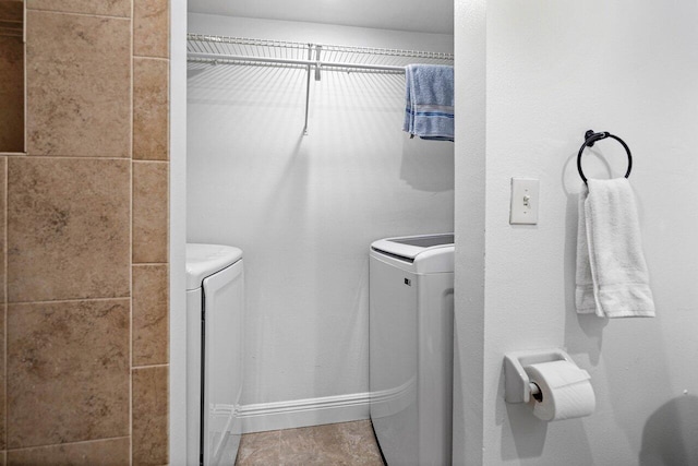 interior space with laundry area and washing machine and clothes dryer