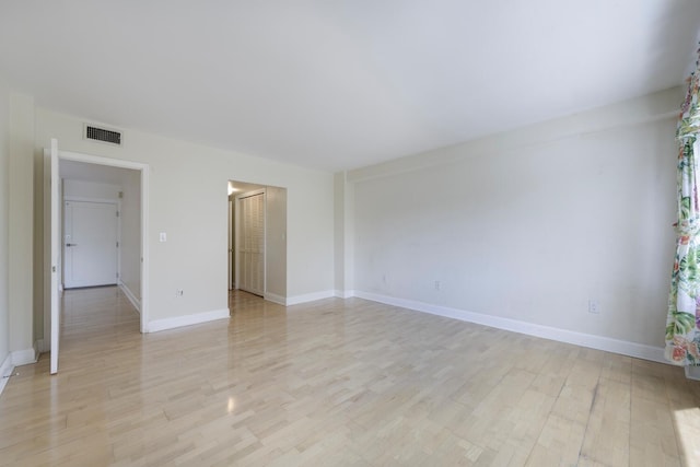 empty room with light wood-type flooring