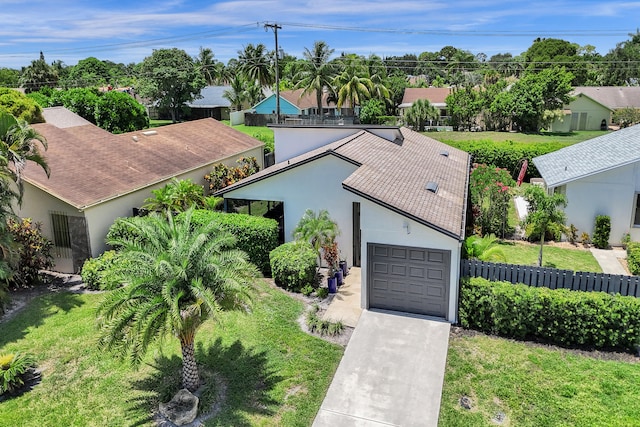 view of front of property with a garage and a front yard