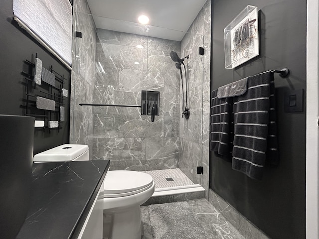 bathroom with an enclosed shower and toilet