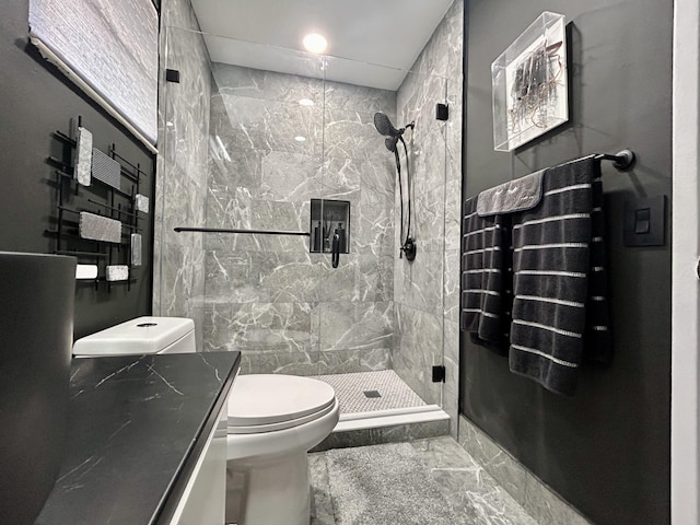 bathroom with walk in shower and toilet