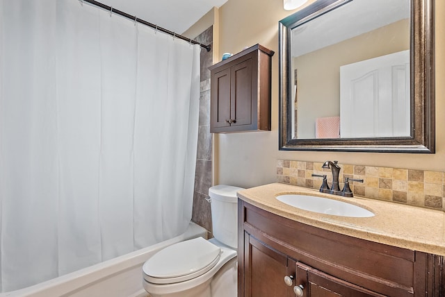 full bathroom featuring toilet, vanity, shower / bath combo with shower curtain, and tasteful backsplash