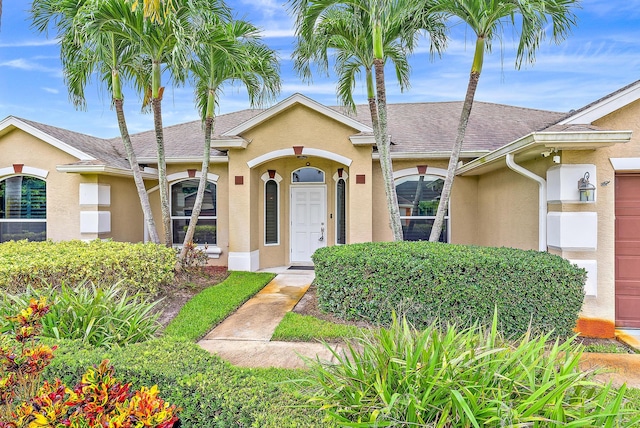 single story home featuring a garage