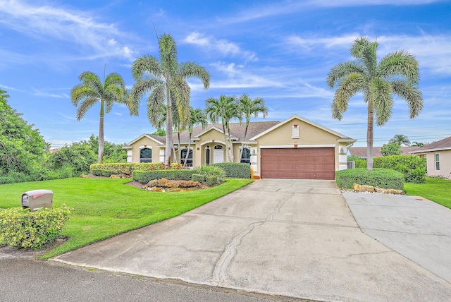 ranch-style house with a garage and a front lawn