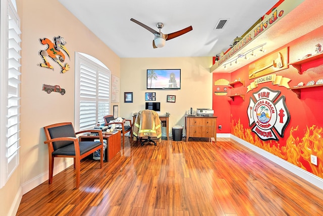 office space with hardwood / wood-style floors and ceiling fan