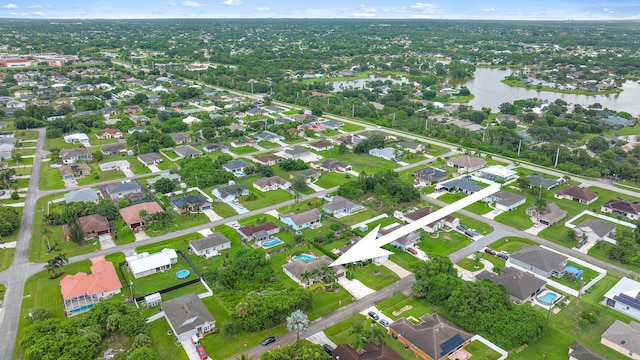 drone / aerial view with a water view