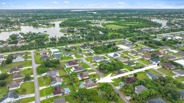 birds eye view of property featuring a water view