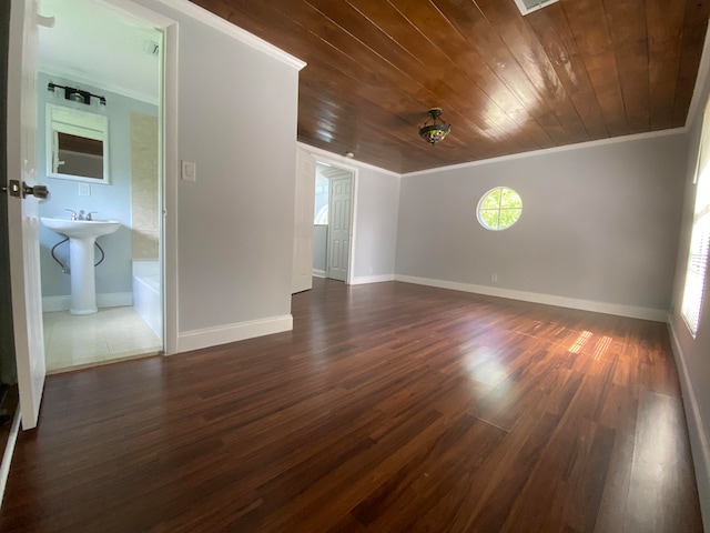 tiled spare room with wooden ceiling and crown molding