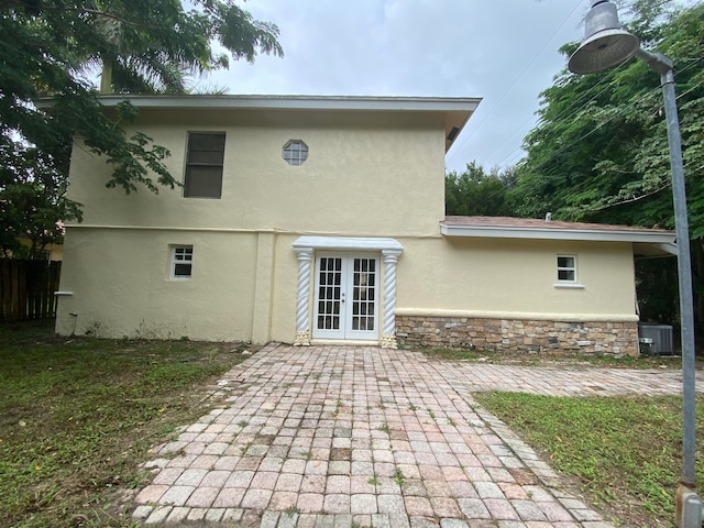 back of property featuring central AC, a patio, and french doors