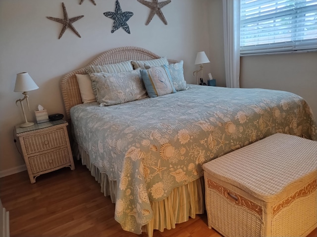 bedroom featuring dark hardwood / wood-style floors