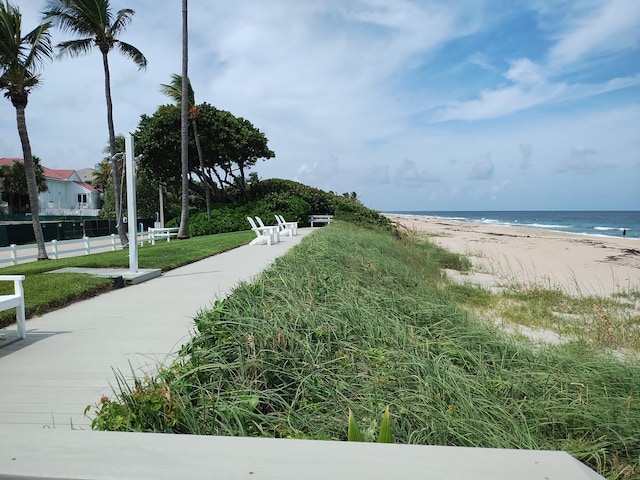 view of community with a water view and a view of the beach