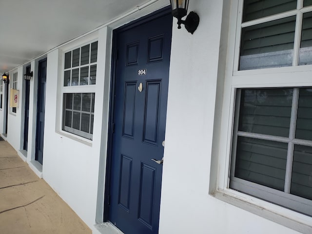 entrance to property featuring a porch