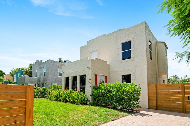 view of front of property with a front lawn