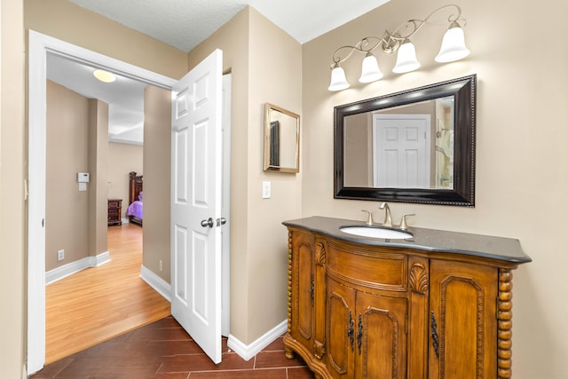 bathroom featuring hardwood / wood-style flooring and vanity