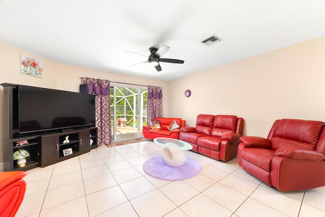 living room with ceiling fan and light tile patterned floors