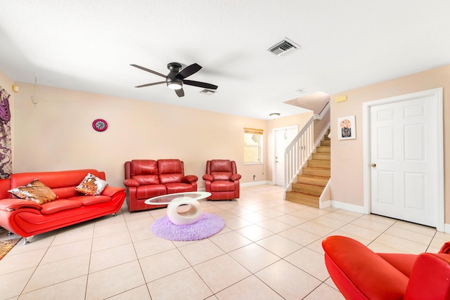 tiled living room featuring ceiling fan