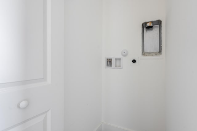 washroom featuring electric dryer hookup, gas dryer hookup, hookup for a washing machine, and laundry area