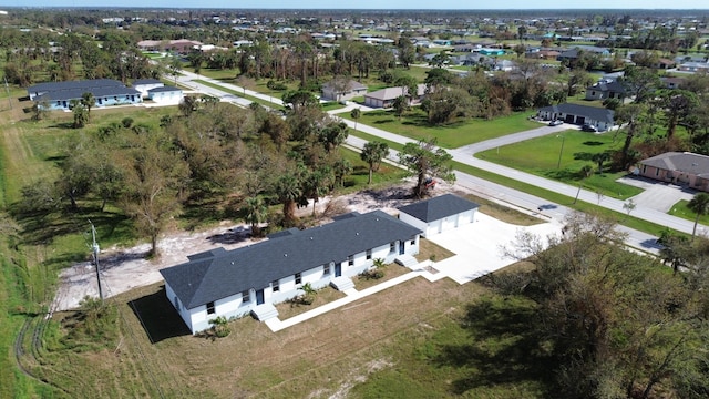 birds eye view of property with a residential view