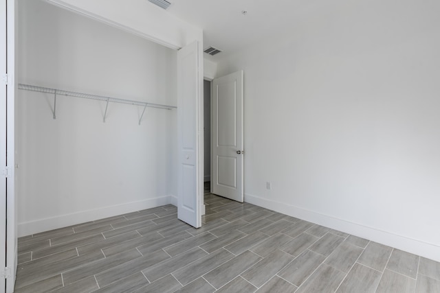 unfurnished bedroom featuring a closet