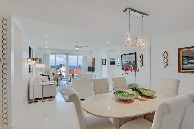 dining area featuring ceiling fan and tile patterned floors