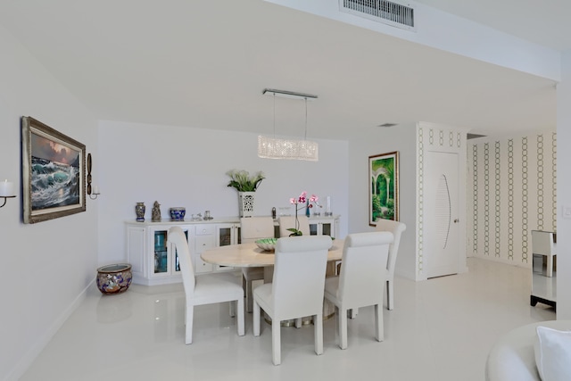 dining space with an inviting chandelier