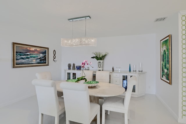 dining room with a notable chandelier