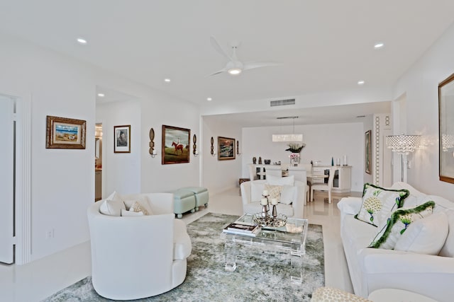 tiled living room with ceiling fan