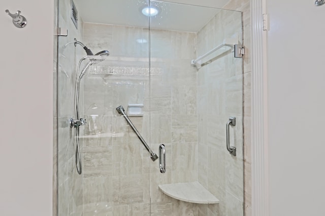 bathroom with a shower with shower door