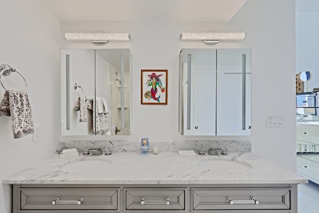 bathroom with dual bowl vanity