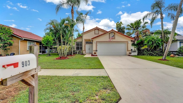 view of front of house with a garage and a front yard