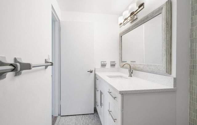 bathroom featuring tile patterned flooring and vanity