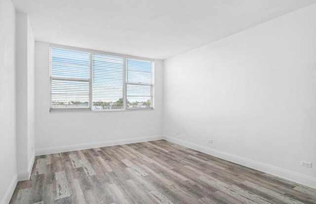 spare room featuring hardwood / wood-style floors