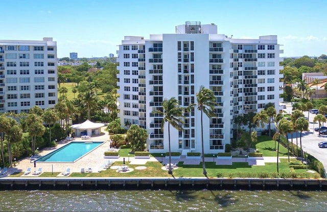 view of building exterior with a community pool