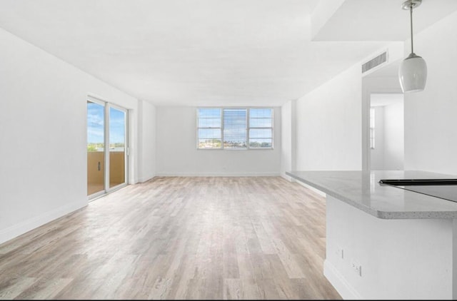 unfurnished living room featuring light wood-type flooring