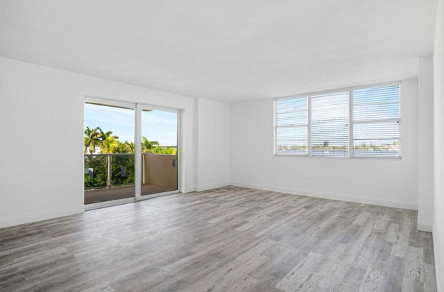 spare room featuring light wood-type flooring