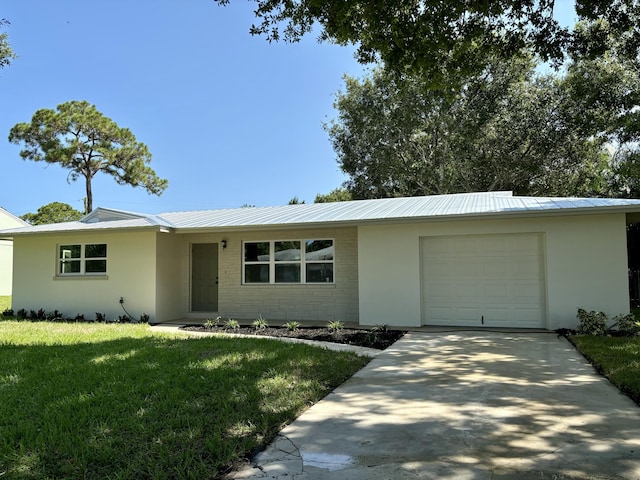 ranch-style house with a front yard and a garage