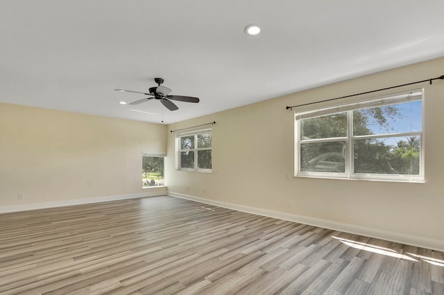 unfurnished room with light hardwood / wood-style flooring and ceiling fan