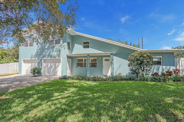 view of front of home featuring a garage and a front yard