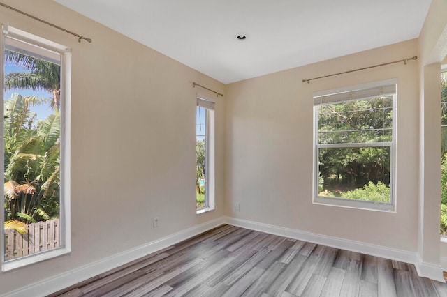 spare room with light hardwood / wood-style floors