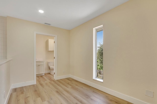 unfurnished room featuring light wood-type flooring