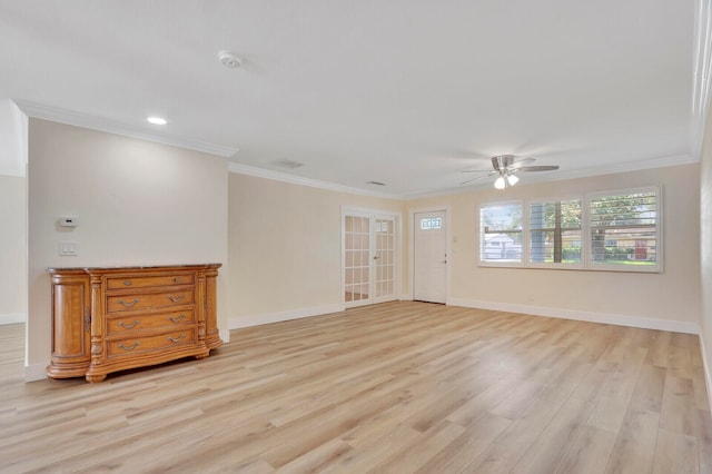 spare room featuring ceiling fan, crown molding, and light hardwood / wood-style floors