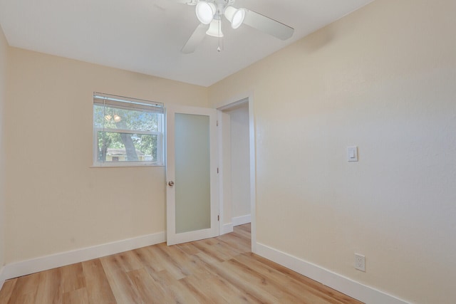 empty room with light hardwood / wood-style floors and ceiling fan