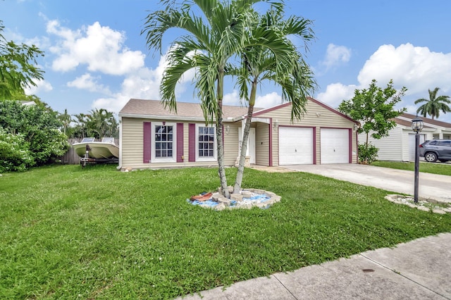 view of front of property with a front lawn and a garage